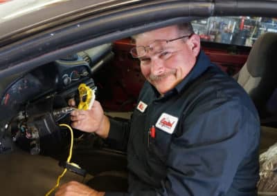 Mechanic working on a vehichle - Capitol Automotive